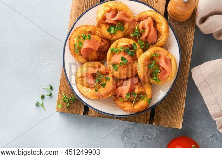 Yorkshire Pudding. Traditional English Yorkshire Pudding With Salmon And Radish Microgreens Side Dis