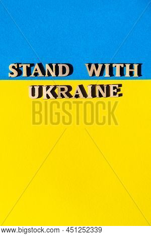 Ukrainian National Flag Made Of Paper. Stand With Ukraine Text. Stop War. The Concept Of Ending The 