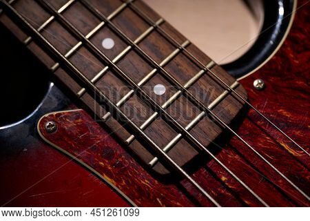 Metallic Volume Treble Guitar Bass Knobs. Electric Guitar. Red Electric Bass Guitar Close-up. Musica
