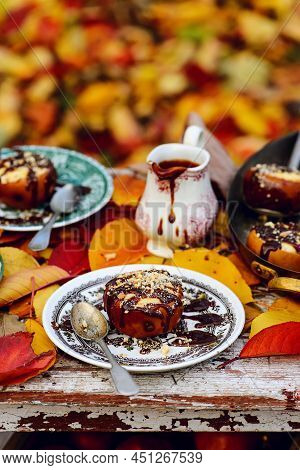 Stuffed Apple Cheesecake On The Table In The Autumn Garden . Selective Focus