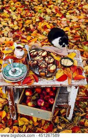 Stuffed Apple Cheesecake On The Table In The Autumn Garden . Selective Focus