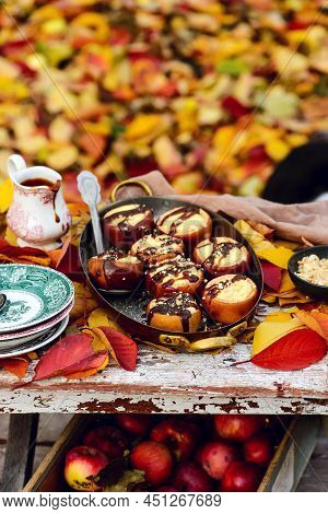 Stuffed Apple Cheesecake On The Table In The Autumn Garden . Selective Focus