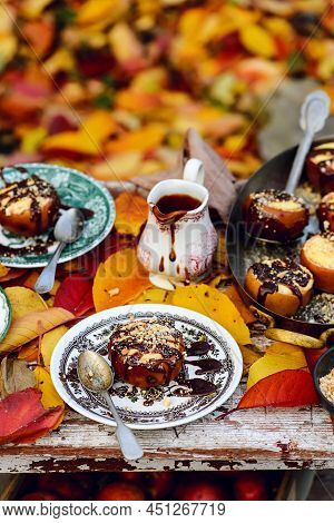 Stuffed Apple Cheesecake On The Table In The Autumn Garden . Selective Focus