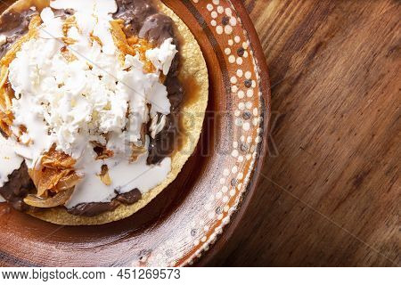 Tostadas De Tinga De Pollo. Traditional Mexican Chicken Toasts With Chicken Breast Meat, Onion And C