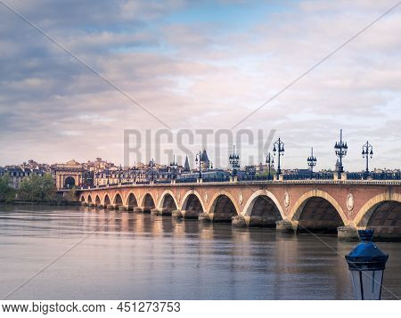 Stone Bridge Over The Garonne River In Bordeaux With The Gourgogne Gate. France.