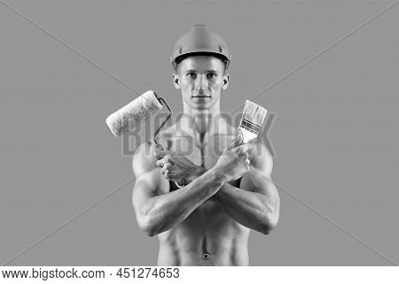 Sexy Man With Muscular Torso Hold Paintroller And Paintbrush For Decorating And Painting, Painter