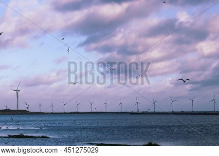 Wind Turbine Farm Power Genarator In Beautiful Nature Landscape For Production Of Renewable Green En