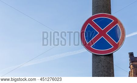 Red And Blue Traffic Sign In Front Of Beautiful Blue Sky Says Absolute No Stopping Here Also On The 