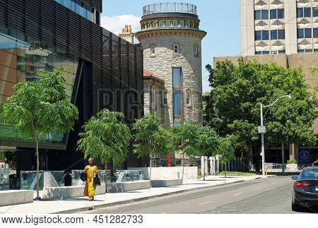 Toronto, Canada -06 17 2016: A Woman Walking Along The Devonshire Pl In Front Of The Goldring Centre