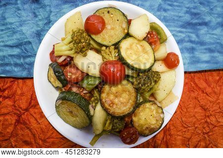 Fresh Homemade Salad Made With Red Cherry Tomato, Broccoli, Peach, Green Zucchini Tasty On White Bac
