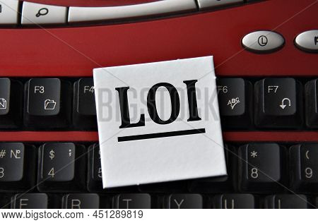 Loi (letter Of Intent) - Abbreviation On A White Sheet Against The Background Of A Computer Keyboard