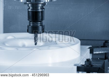 The Cnc Milling Machine Cutting The Pom Material Parts By Solid Ball Endmill Tool. The Plastic Pom C