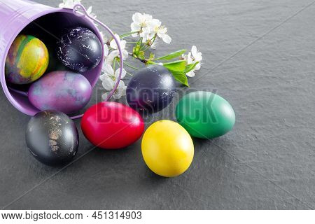 Chicken Bucket  With Painted Easter Eggs On Dark Tabletop. Concept Creative Banner. Holiday Greeting