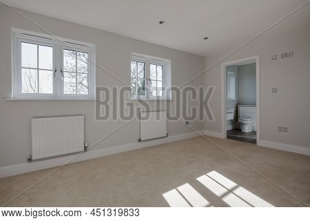 Caldecote, Cambridgeshire - March 15 2017: Modern New Bright Unfurnished Bedroom Interior With Sunli