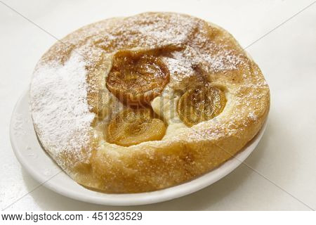 Traditional Spanish Pastry Dessert With Dry Peaches, Ensaimada. Balearic Islands