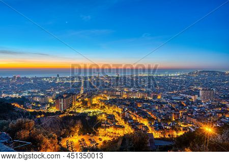 The Skyline Of Barcelona In Spain Before Sunrise