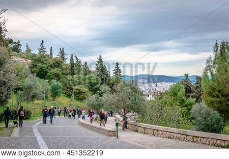 Athens, Greece - April 4 2015: Incidental People On Apostolou Pavlou St, The Pedestrian Zone That Go