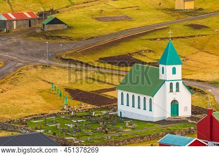 Gjogv, Faroe Islands, Denmark - 05 May 2018: Small Village Gjogv Situated On The Slope Of The Mounta