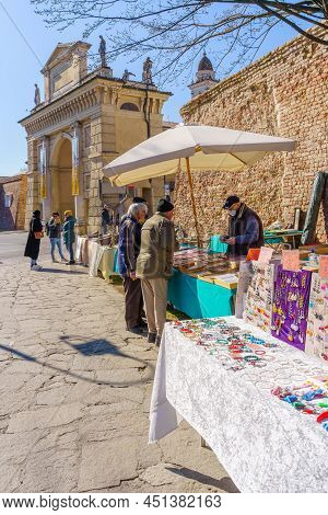 Crema, Italy - February 27, 2022: Sunday Market Scene, With Sellers And Shoppers, In Crema, Lombardy