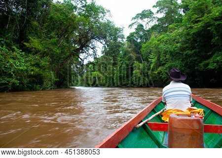 Boat Ride Through The Deep Jungle Of Borneo