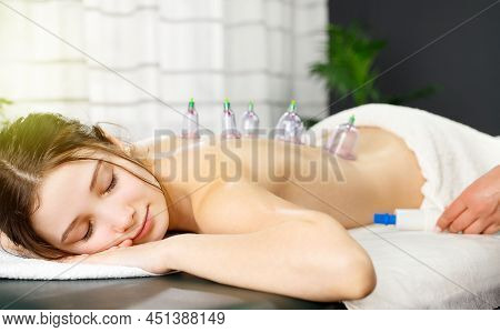 Close Up Photo Of Relaxing Young Pretty Girl Lying On Massage Table With Closed Eyes And Receiving M