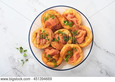 Yorkshire Pudding. Traditional English Yorkshire Pudding With Salmon And Radish Microgreens Side Dis