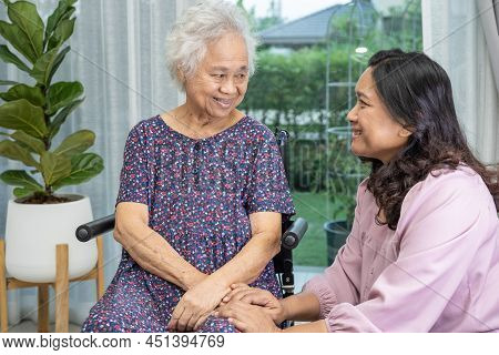 Help And Care Asian Senior Or Elderly Old Lady Woman Patient Sitting On Wheelchair At Nursing Hospit