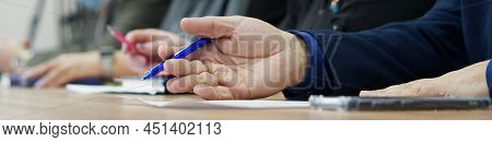 Man's Hand With Pen On The Table Next To The Document. Age Official, Boss, Lawyer Or Businessman. Pa
