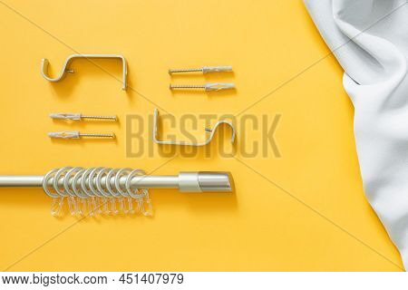 Curtain Rod With Fasteners, Rings And Hooks For Hanging Curtains On A Yellow Background And Curtain 