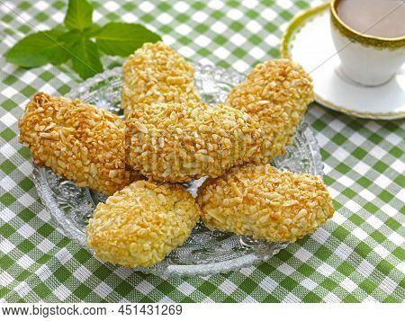 A Traditional Greek Sweet Bite Made Of Almond Paste And Covered With Almond Springles And Honey.