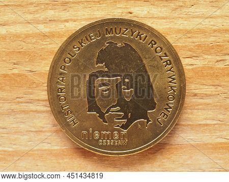 Two Zloty Coin Currency Of Poland Over Wooden Background