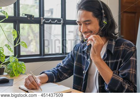 Young Asian Hight School Student Man Is Studying,learning Academic Lesson Online Wearing Headset,ear