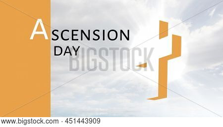 Digital composite image of ascension day text by back lit cross against sky. religion, spirituality and christainity concept.