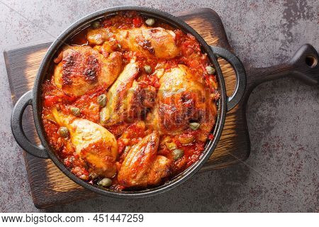Rustic Style Chicken Baked With A Sauce Of Tomatoes, Peppers, Onions And Garlic Close-up In A Frying