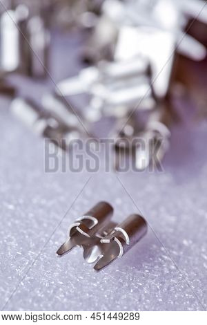 Batch Of Silver Tinned External Connectors For Pcb Placed Bulk On White. Horizontal Image Orientatio