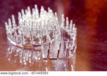 Electronic Concepts. Line Of Silver Tinned External Pcb Angular Connectors Over White Background.