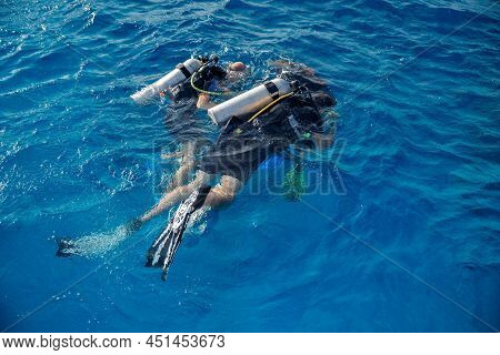 Diving Training, Instructor Instructs Tourists To Dive Underwater With Scuba Diving In Sea, Top View