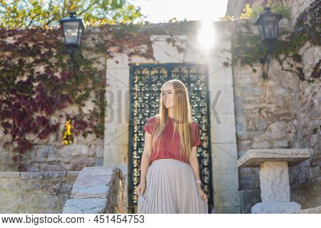 Woman Tourist On Background Of Beautiful View Of The Island Of St. Stephen, Sveti Stefan On The Budv