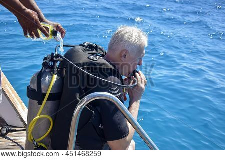 Scuba Diver Before Diving. Diving Lesson In Open Water. Male In Scuba Diving Suit Is Preparing To Di