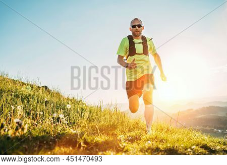 Active Mountain Trail Runner Dressed Bright T-shirt With Backpack In Sport Sunglasses Running Endura