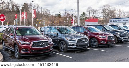 Monroeville, Pennsylvania, Usa March 20, 2022 Different Infinity Vehicles For Sale Lined Up At A Dea