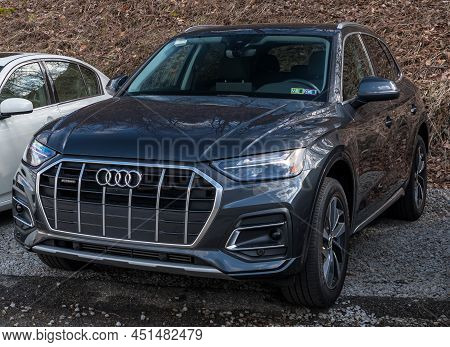 Monroeville, Pennsylvania, Usa March 20, 2022 A New Dark Blue Audi Sedan For Sale At A Dealership On