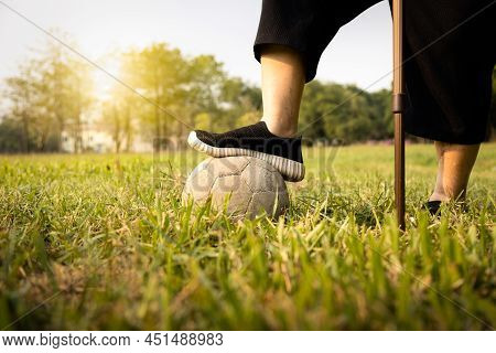Asian Senior Woman Exercising,excellent Healthy With Soccer Ball, Female Elderly With Walking Stick,