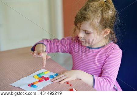 Little Creative Toddler Girl Making Colorful Giraffe With Playmais. Active Happy Child Having Fun Wi