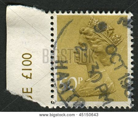UK-CIRCA 1977:A stempel trykt i UK viser billede af Elizabeth II er den forfatningsmæssige monark af 16 