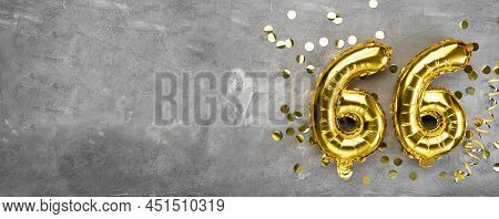 Yellow Foil Balloon Number, Number Sixty Six On A Concrete Background. Greeting Card With The Inscri