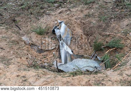 Remains Of The Grad Multiple Rocket Launcher In The Crater. Consequence Of The Shelling Of The City 
