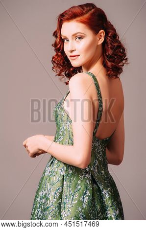 Green Backless Evening Dress. Beautiful Model Wearing Emerald High Heels, Modern Feminine Look For A