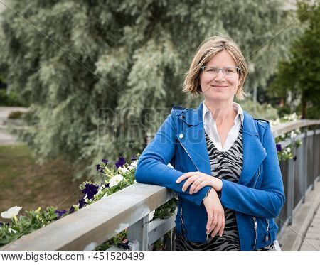 Attractive Thirty Year Old Woman Posing On A Bridge In Old Town, Sundsvall, Sweden