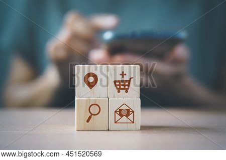 Wooden Cube Blocks With Buyer Persona Icons And Blurred Woman  For Buyer Persona And Target Customer